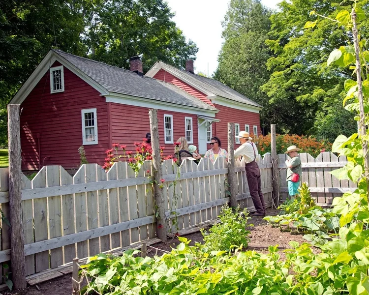 Farmhouse and garden at the Almanzo Wilder Homestead in Malone.