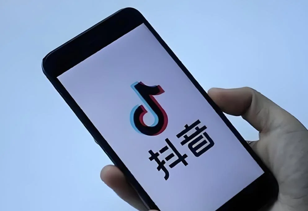 Douyin app splash screen on smartphone showing the content-driven platform interface for China social commerce