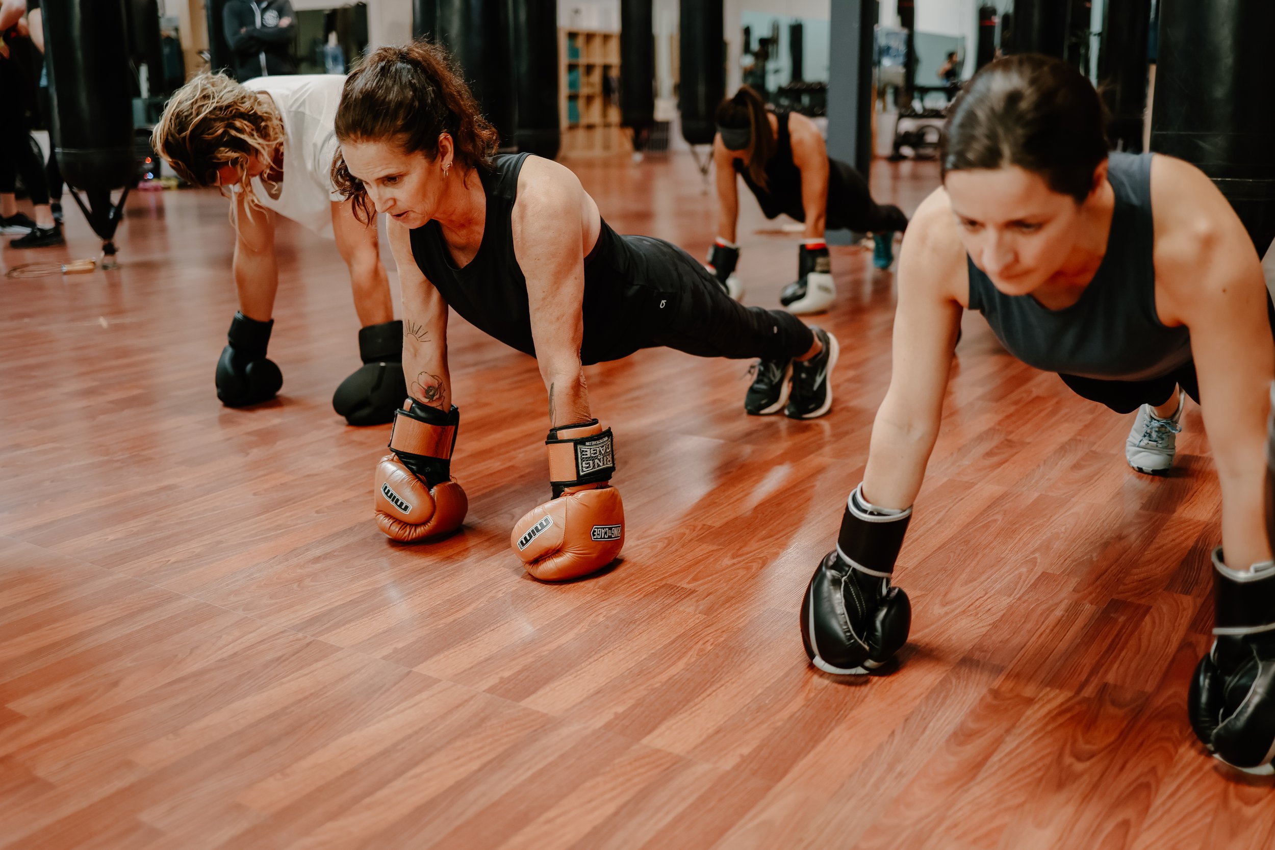 Fitboxing class — floor work with gloves