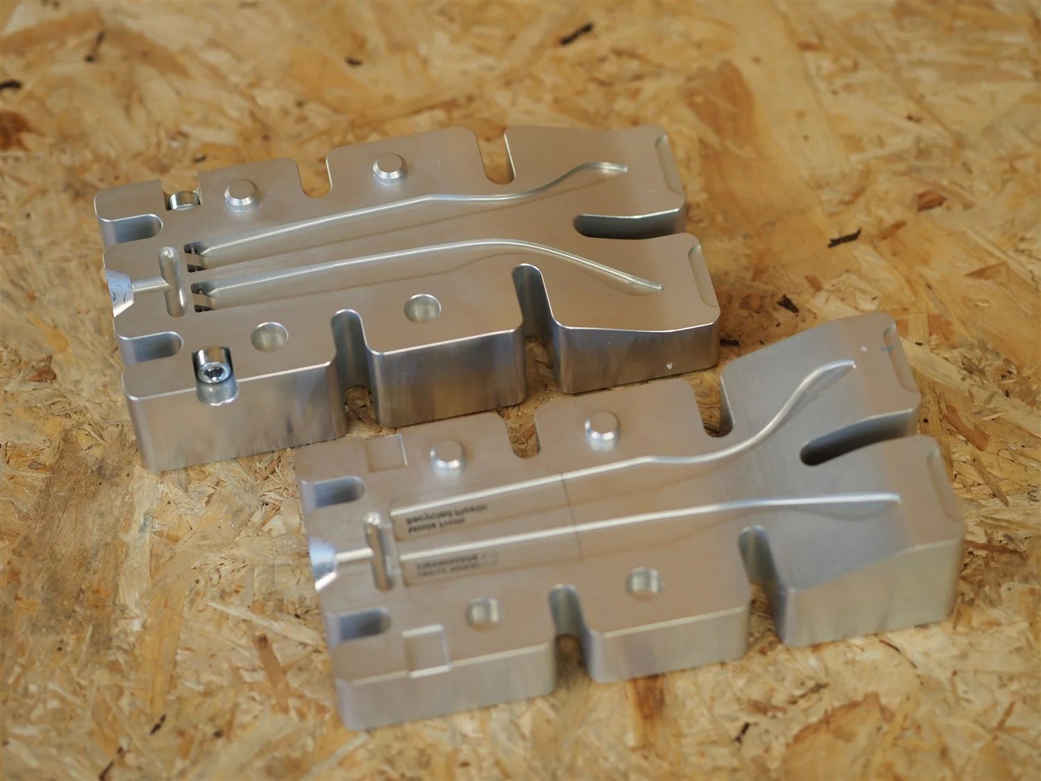 Both halves of the arms mould open on the bench, cavities and runner channels clean and empty