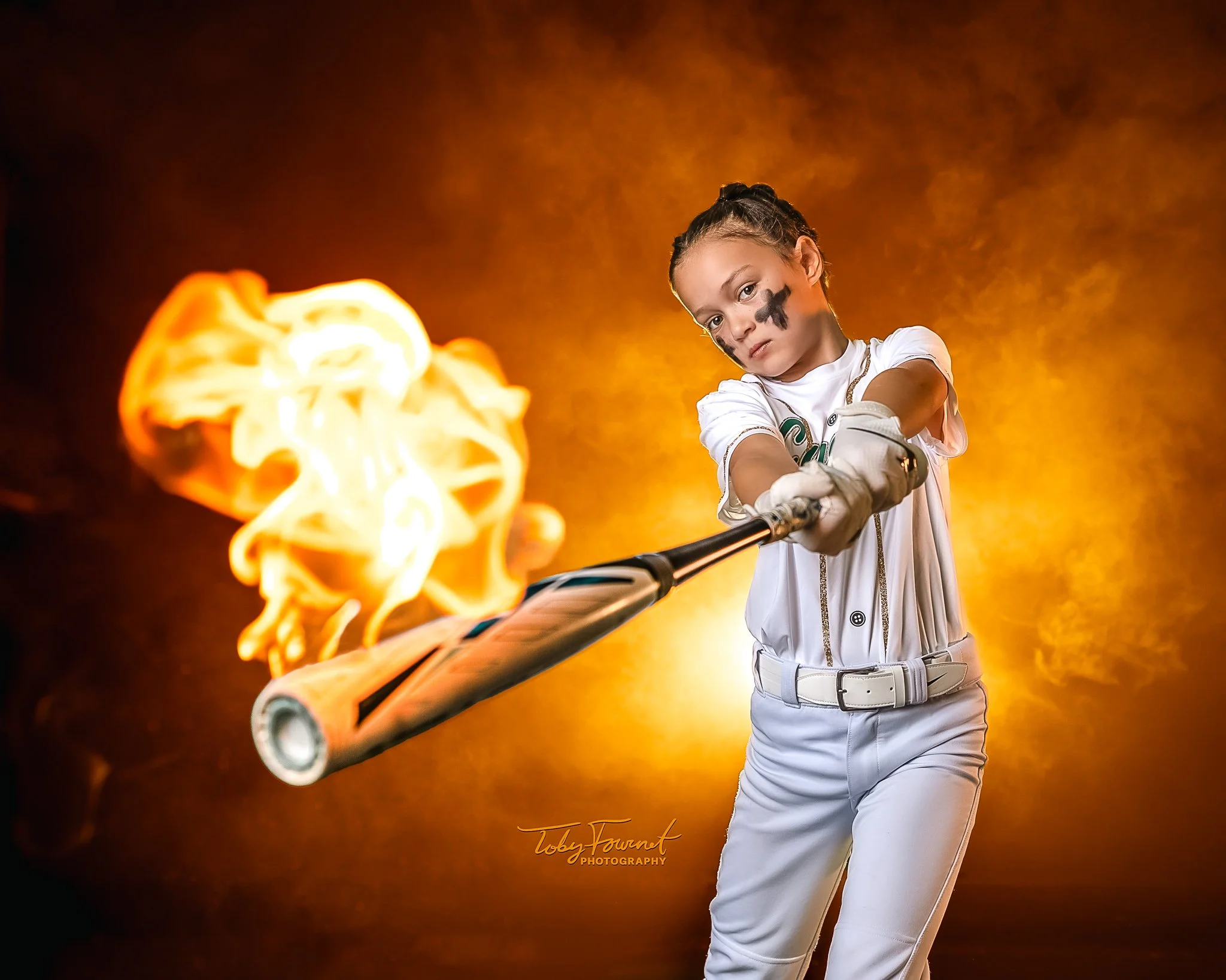 Softball portrait with a bat toward the camera and a flame effect