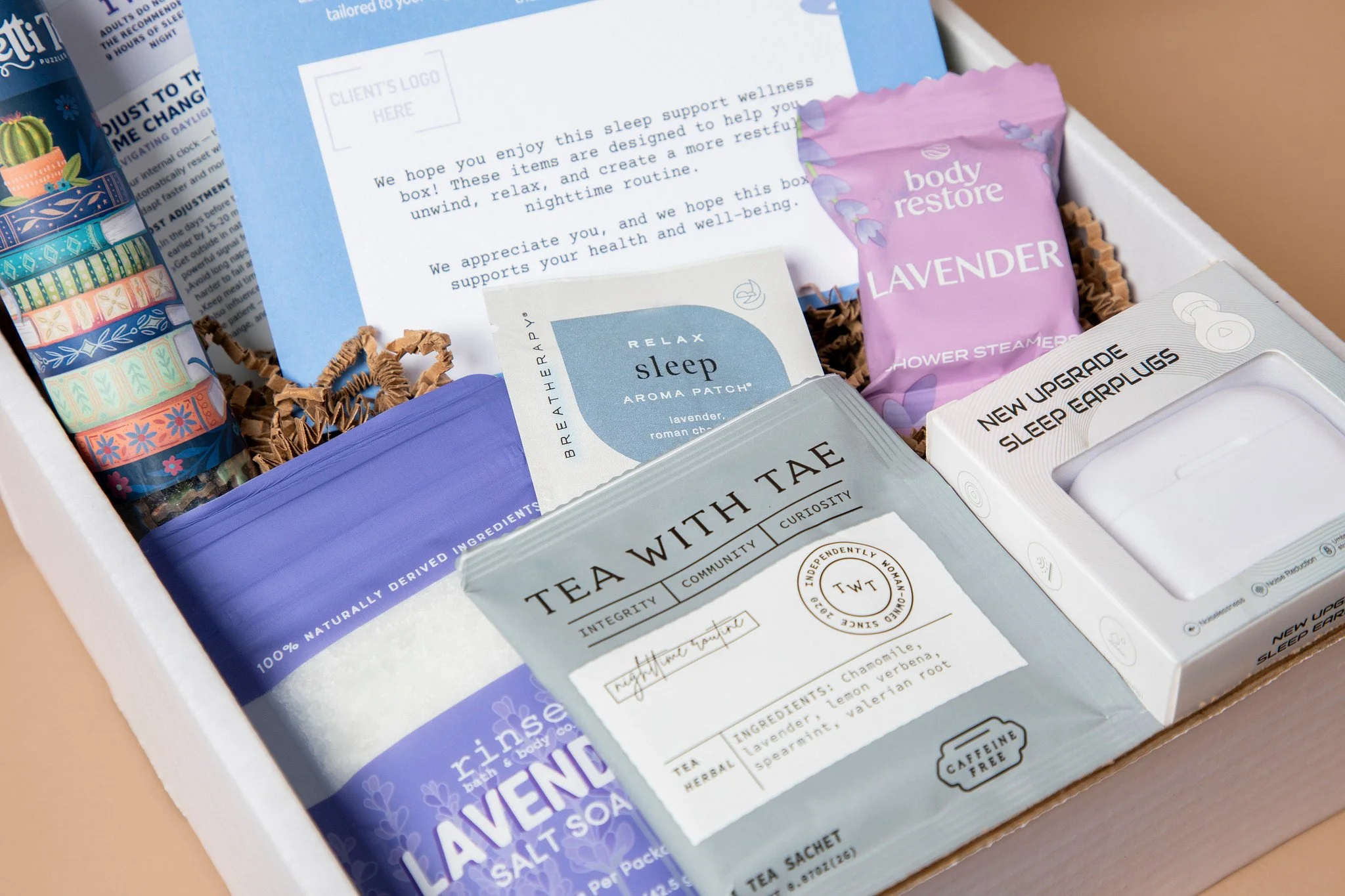 Sleep Support wellness box with a personalized notecard from the employer, relaxing tea, an aroma patch, lavender bath items and sleep earplugs