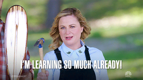 A white woman in overalls says "I'm learning so much already!" 