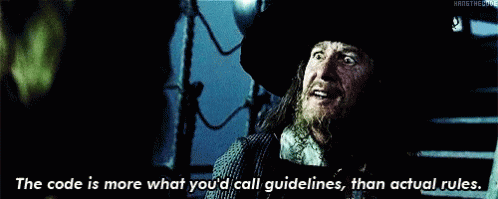 A white, bearded man in a pirate hat says "The code is more what you'd call guidelines, than actual rules" 