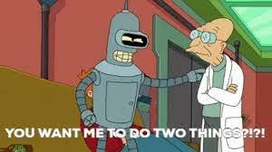 A robot and a man stand together talking and the robot says "You Want me to do two things?" 