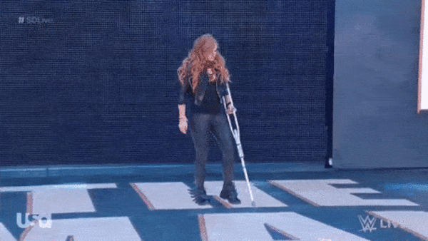 Image is a video of a red-haired white woman holding a crutch and then THROWING it away. This was my mental image of what my first PT session would be like. 