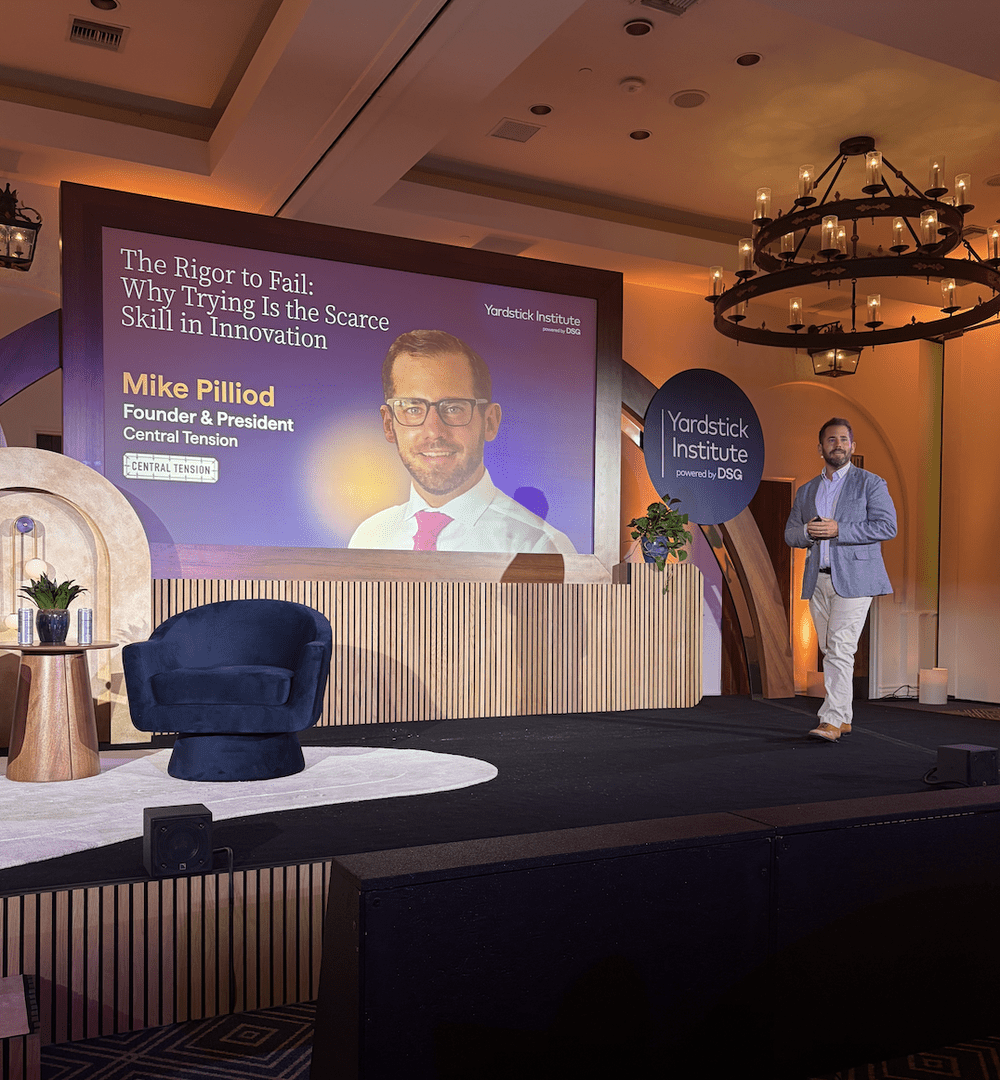 Michael Pilliod on stage at the Yardstick Institute