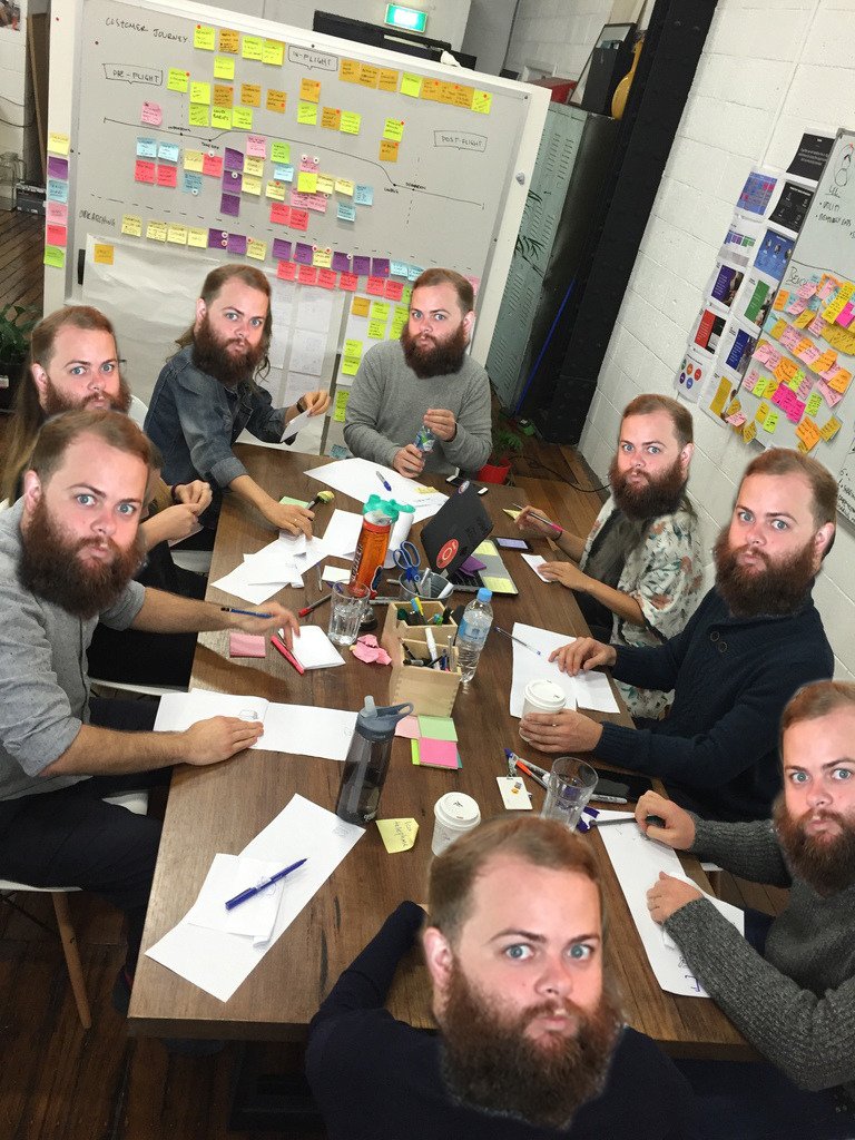 Photo of participants in a workshop, everyone has had ther faces replaced with mine.