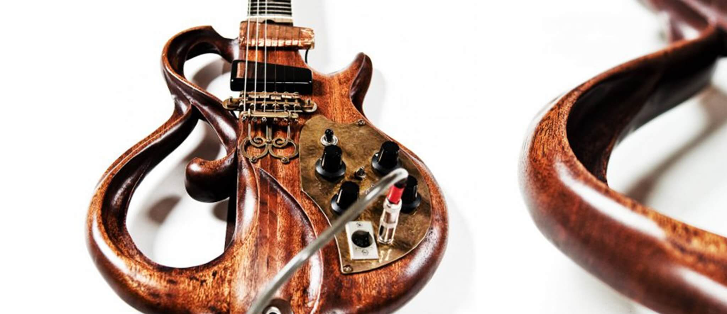 Rick Turner’s Pretzel guitar, with large flowing openings through its wooden body and an opening detail at right