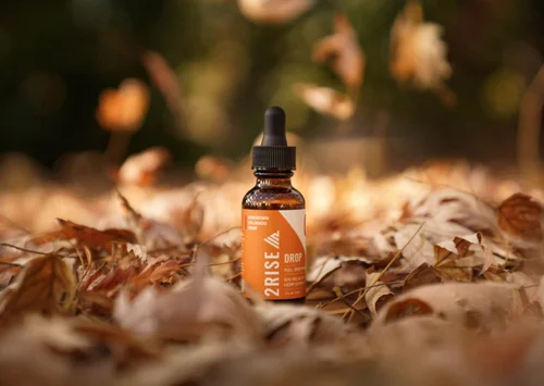 A 2Rise Drops premium tincture bottle, styled for a commercial shoot in Los Angeles