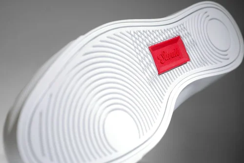 Savalé skate shoe outsole with the red embossed logo tab, footwear detail product photography