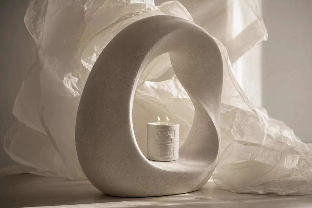 A commercial photography shoot styling a luxury candle for a lifestyle campaign in Los Angeles