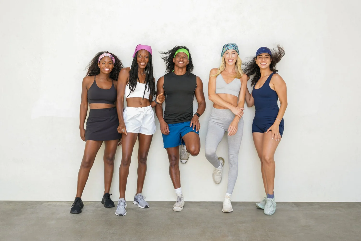 Five athletes in Gymwrap headbands and activewear photographed for a Gymwrap fitness campaign by Chris Frara Studios in Los Angeles