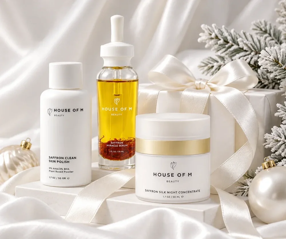 House of M Beauty skincare gift set photographed for a Christmas campaign with soft directional studio light, controlled glass highlights, crisp labels and luminous gold serum.