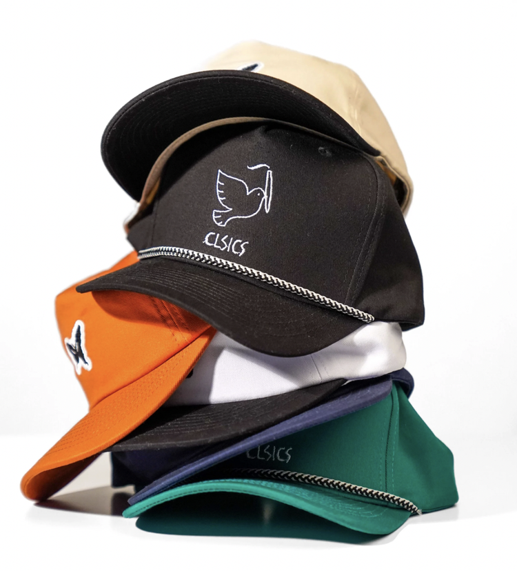 Stacked baseball caps product photography for a headwear brand