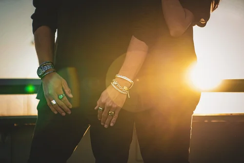 Close-up of Buck Palmer men's silver rings, bracelets and watch at golden hour, commercial jewelry photography in Los Angeles