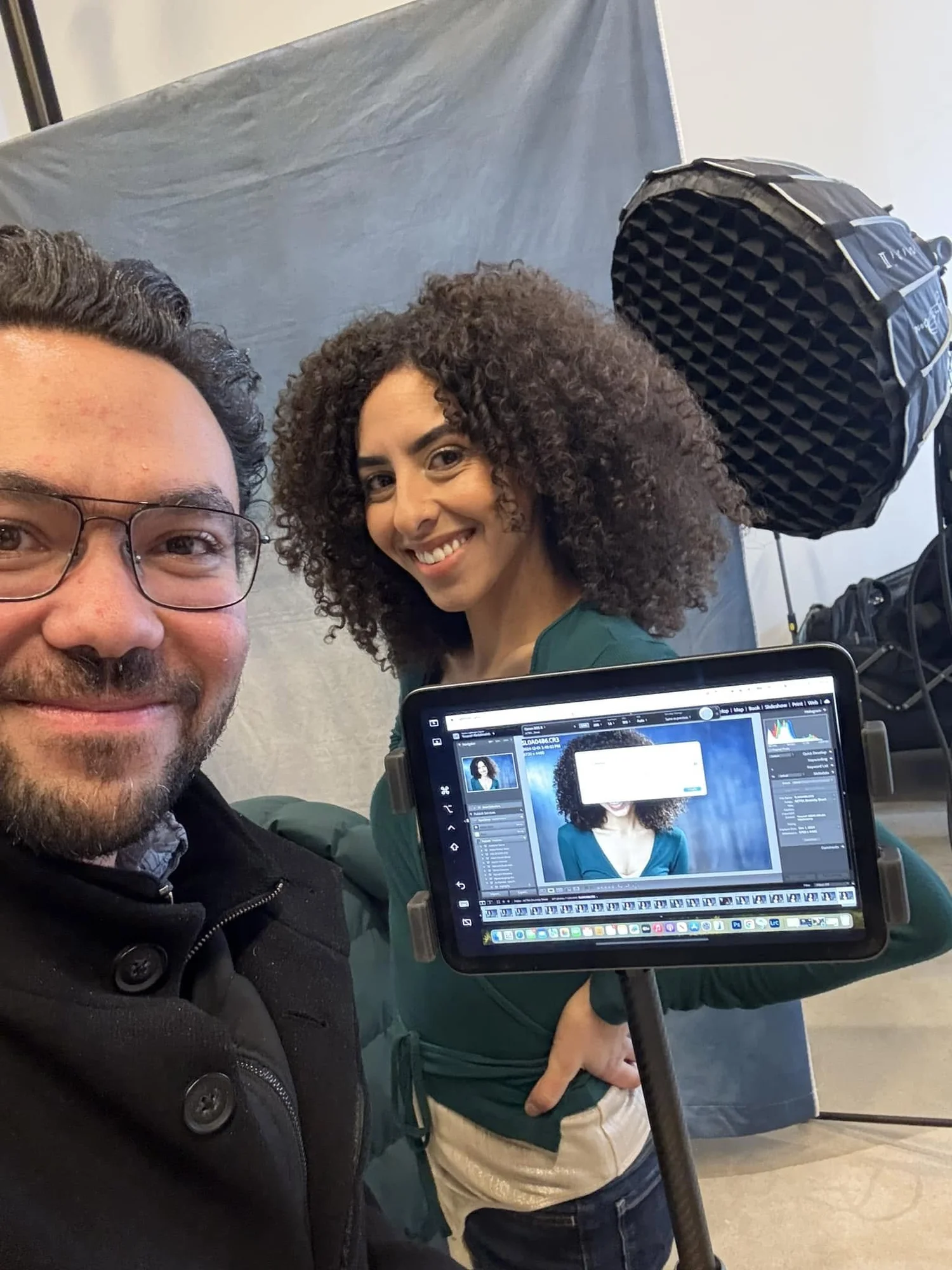 Ymaphoto on location at ACTRA Toronto Picture Day 2024 with actor Andrea Holstein, grey backdrop and gridded softbox behind her, her frame on the tethered screen