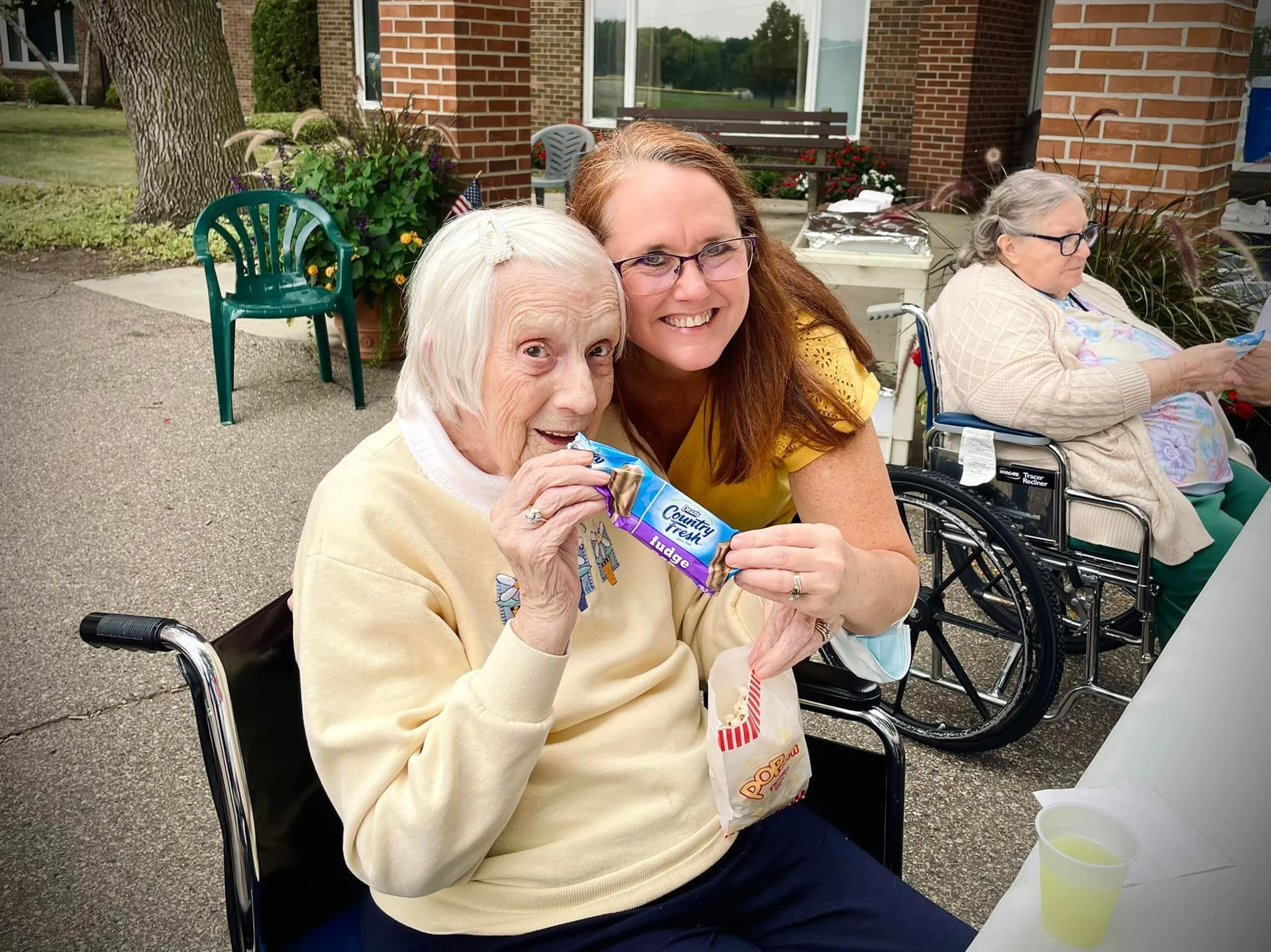 A caregiver sharing a warm moment with a resident