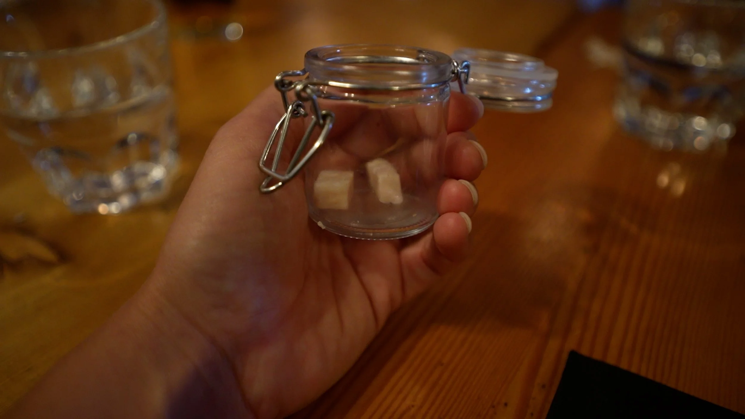 Small jar containing fermented shark (hákarl)