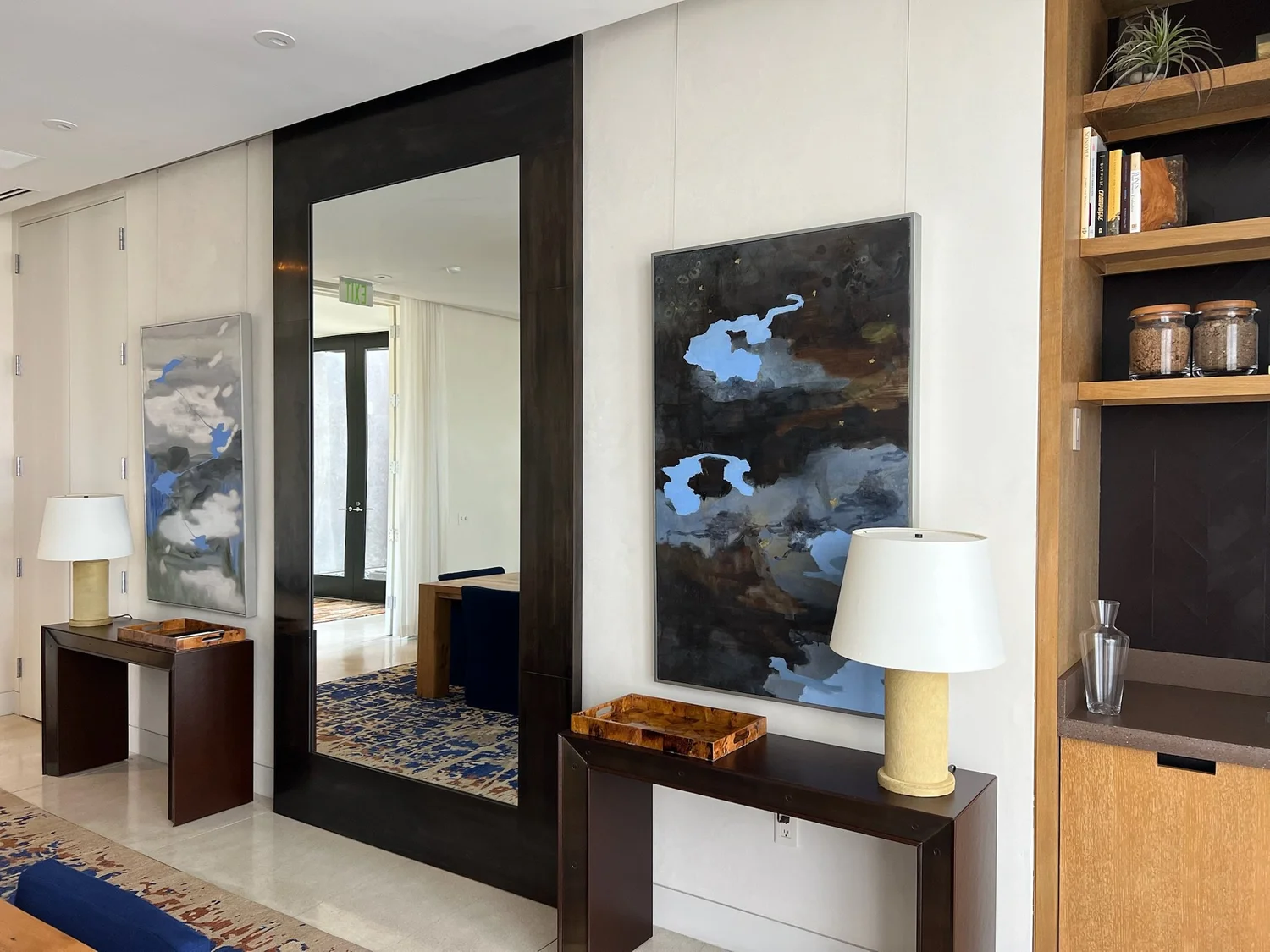 Original paintings thoughtfully placed within a contemporary interior