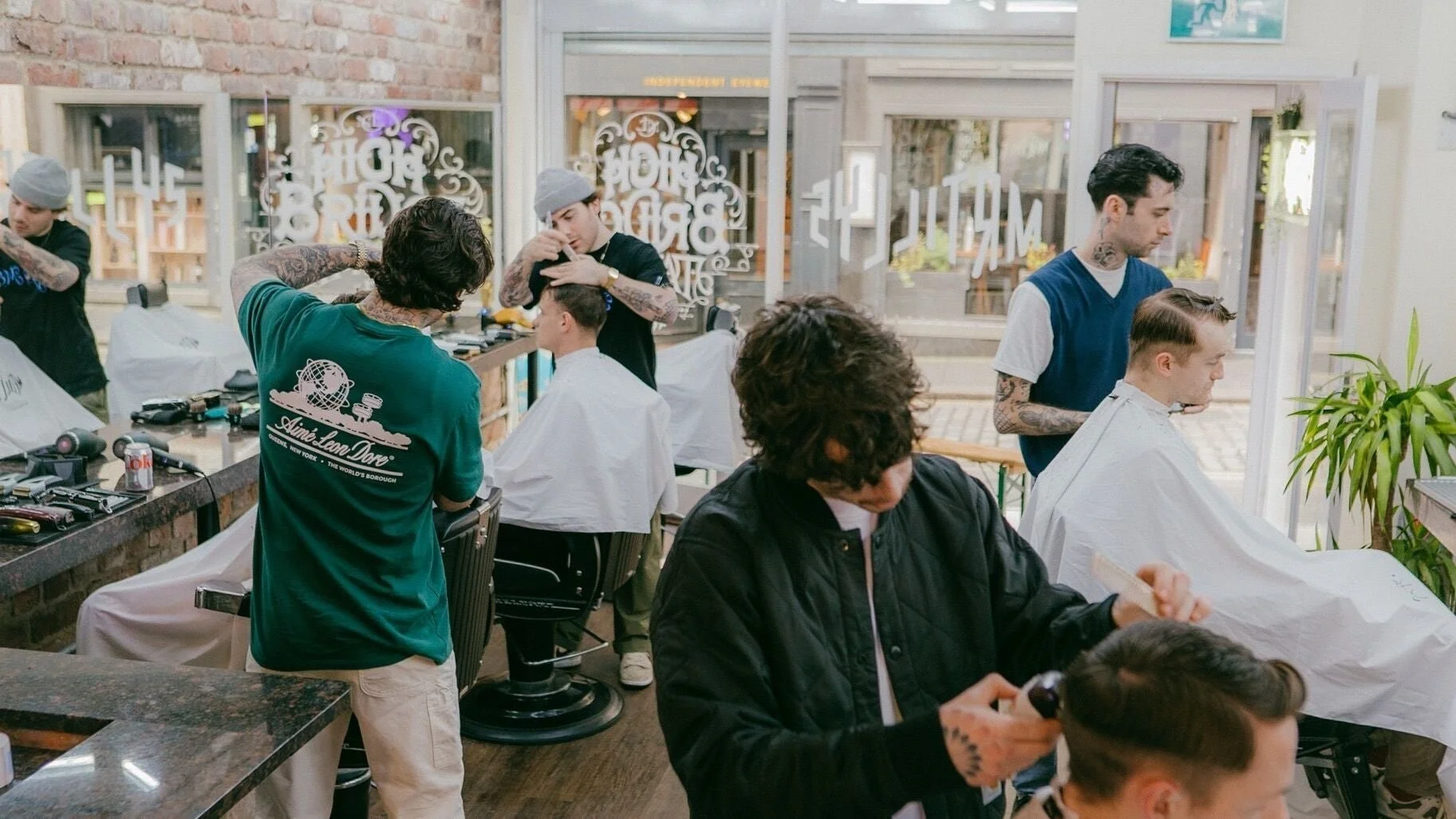 Barbers at work inside Mr Tillys High Bridge, Newcastle