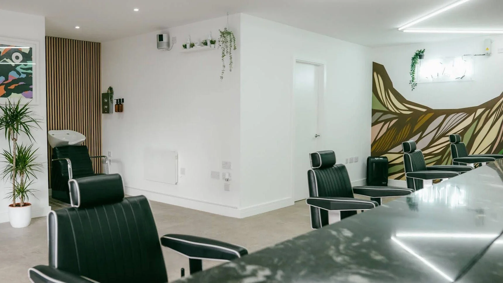 Barber chairs and mural inside Mr Tillys Chillingham Road