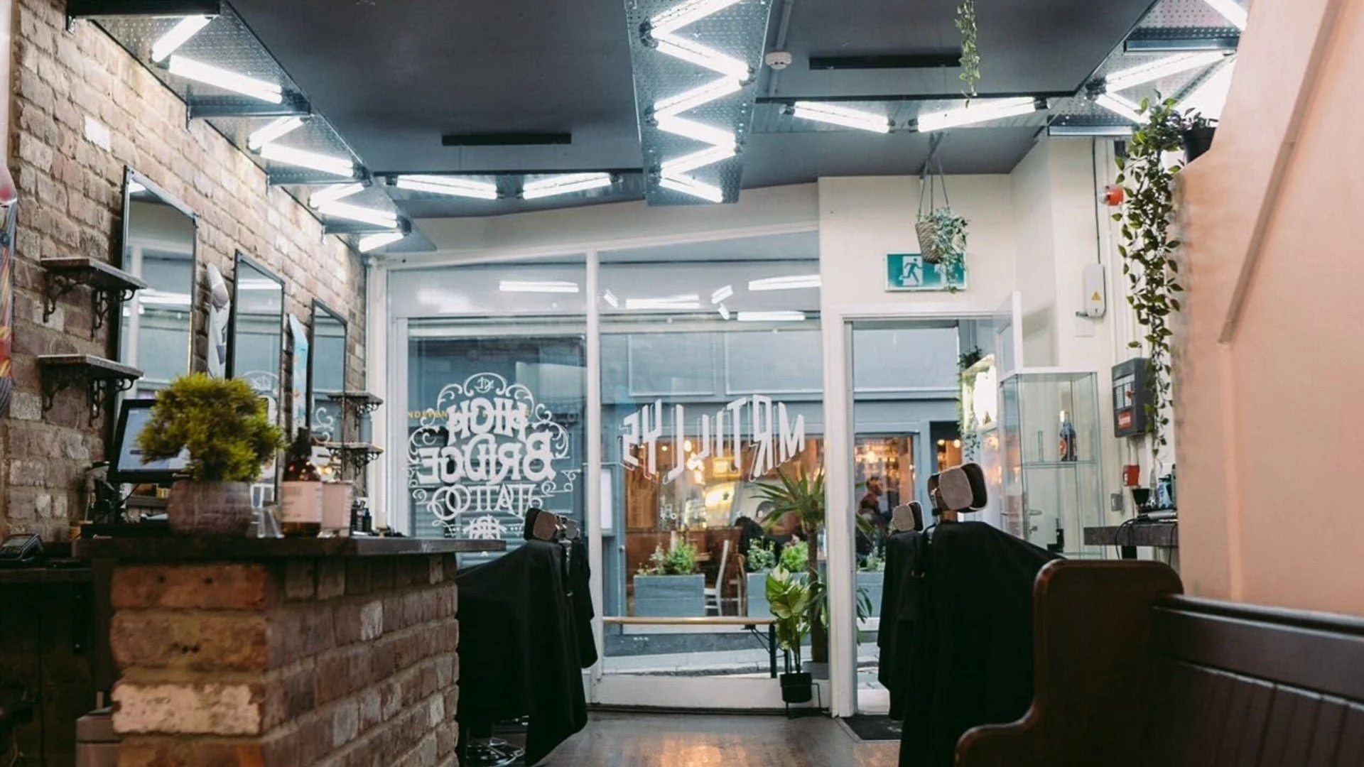 Inside Mr Tillys High Bridge with exposed brick and neon