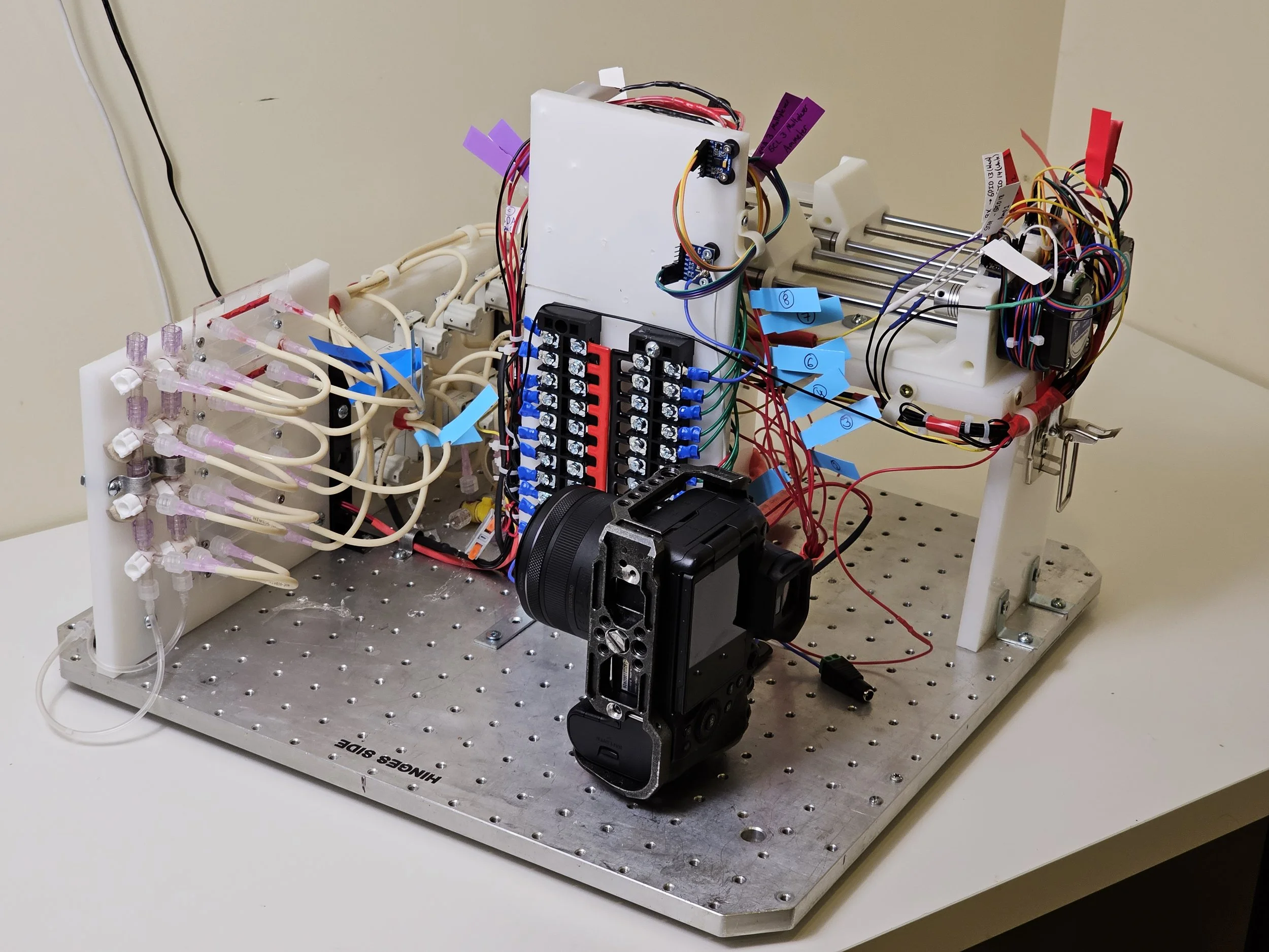 The assembled CLOT-LESS experimental platform, with microchannels, tubing, electronics and imaging camera