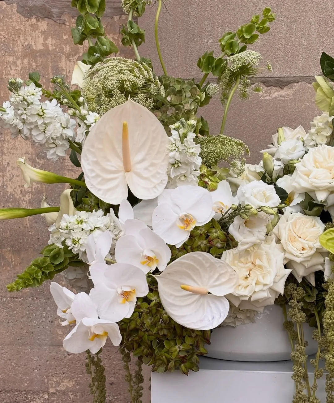 Sculptural white orchids, roses and trailing amaranthus for Callie and Mikey at Artifact Events