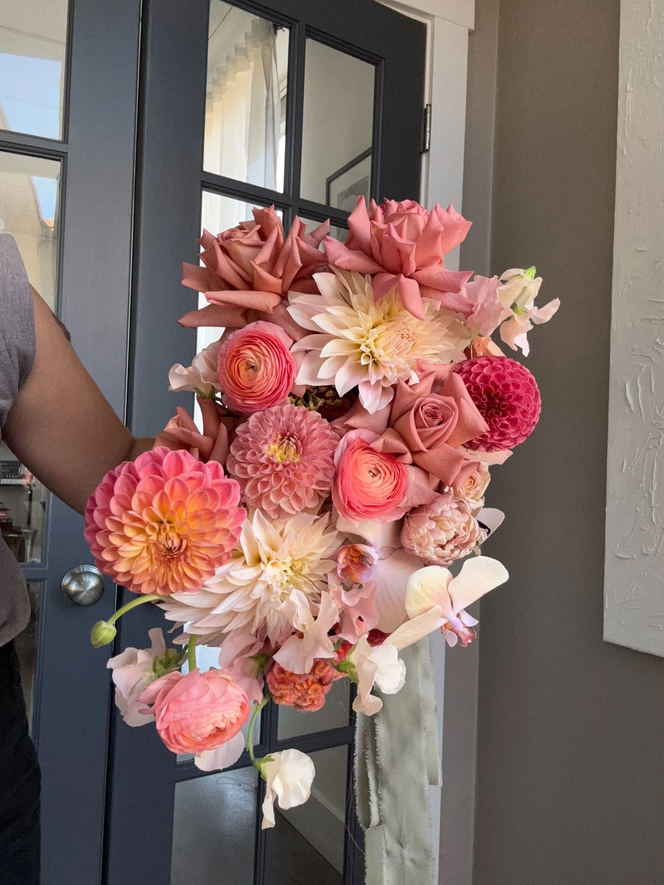 A closer view of Erin’s pink and peach bridal bouquet