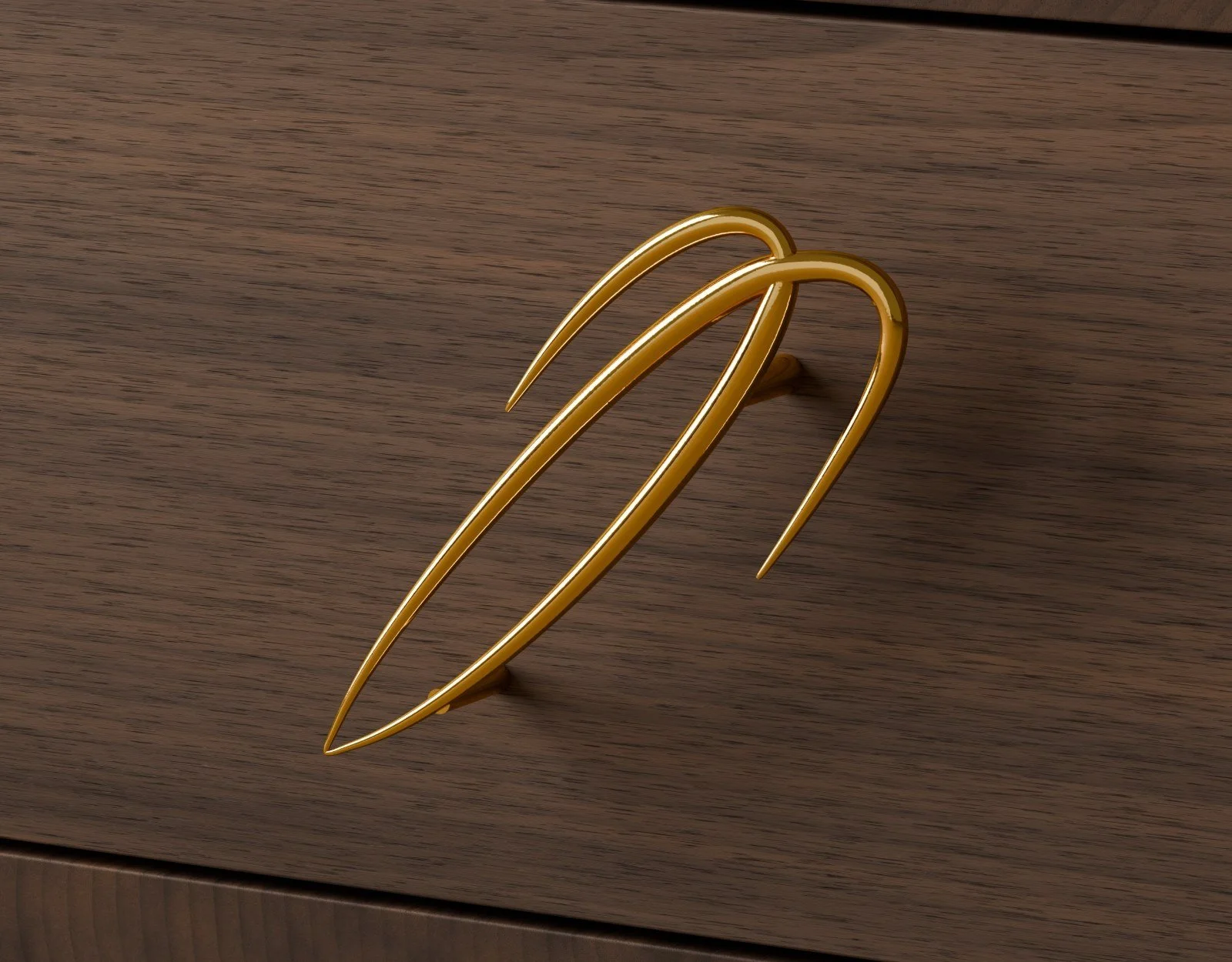 Motif drawer pull in polished brass on an oiled walnut drawer front
