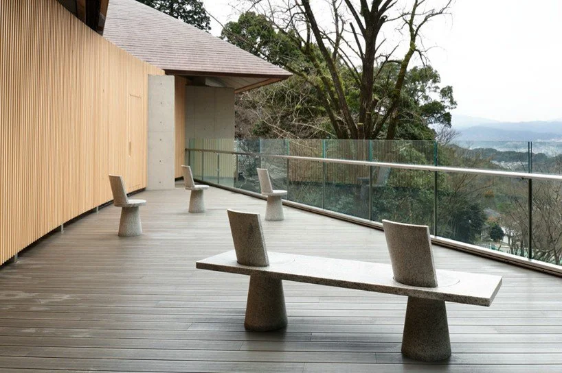 The viewing deck of the Kamado Shrine juyosho in Dazaifu, with Jasper Morrison's benches and chairs spread across it