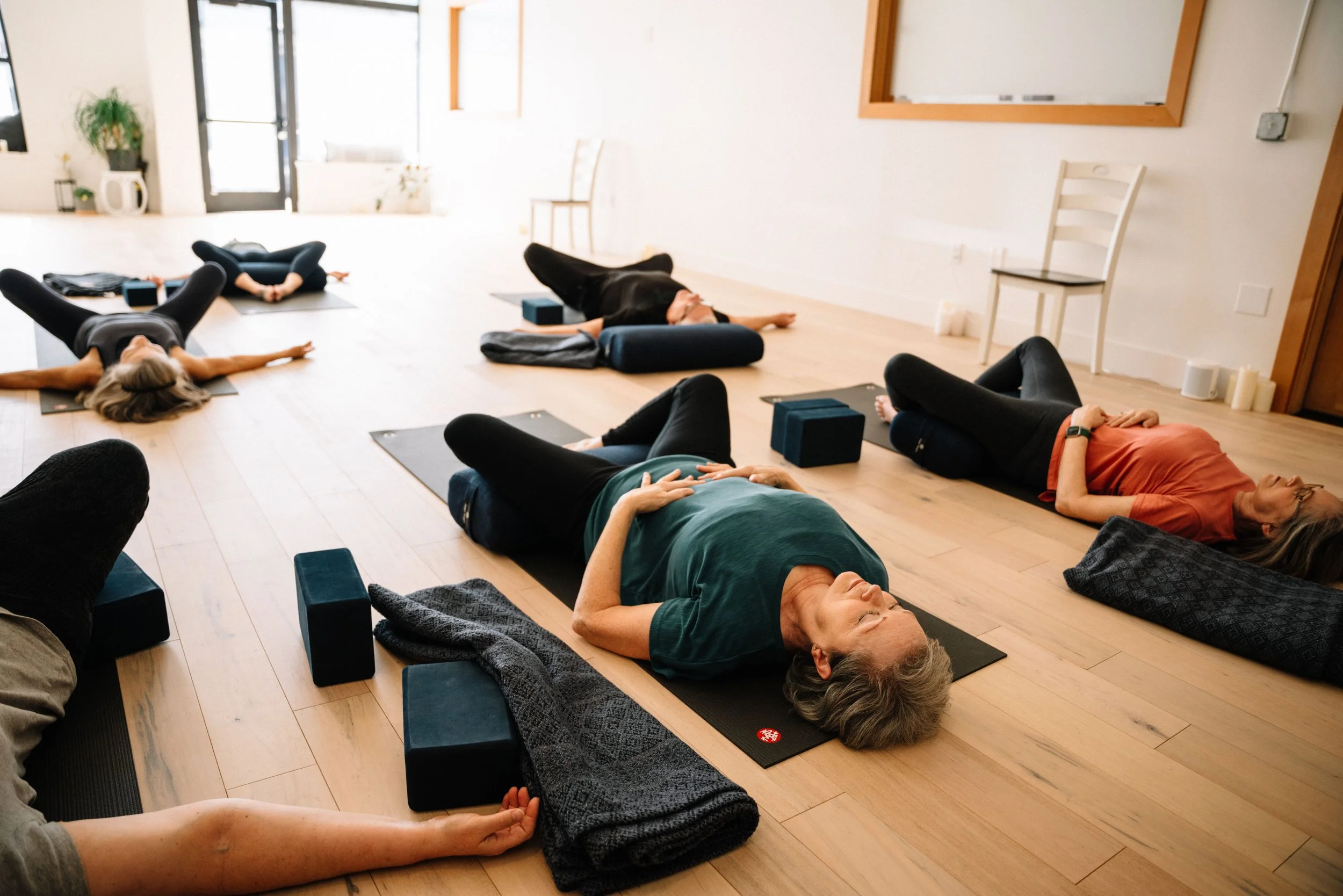A restorative class resting on mats