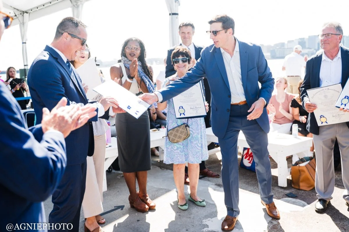 An honoree is recognized at last year's reception in the tent.
