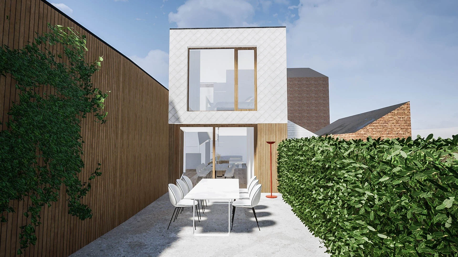 Vue projetée de la façade jardin, volume en bardage losangé et terrasse