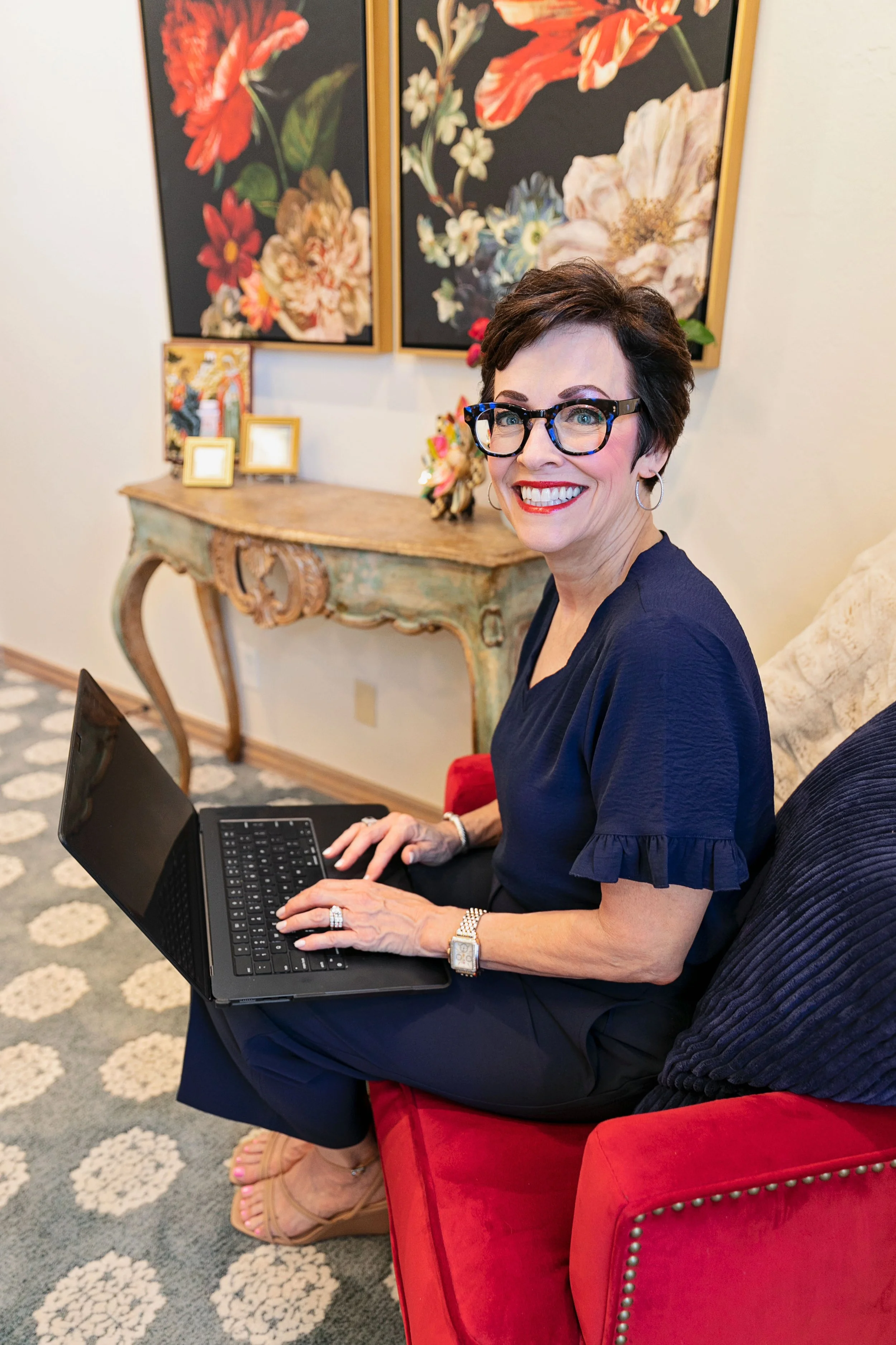Debbie Shadid working on her laptop