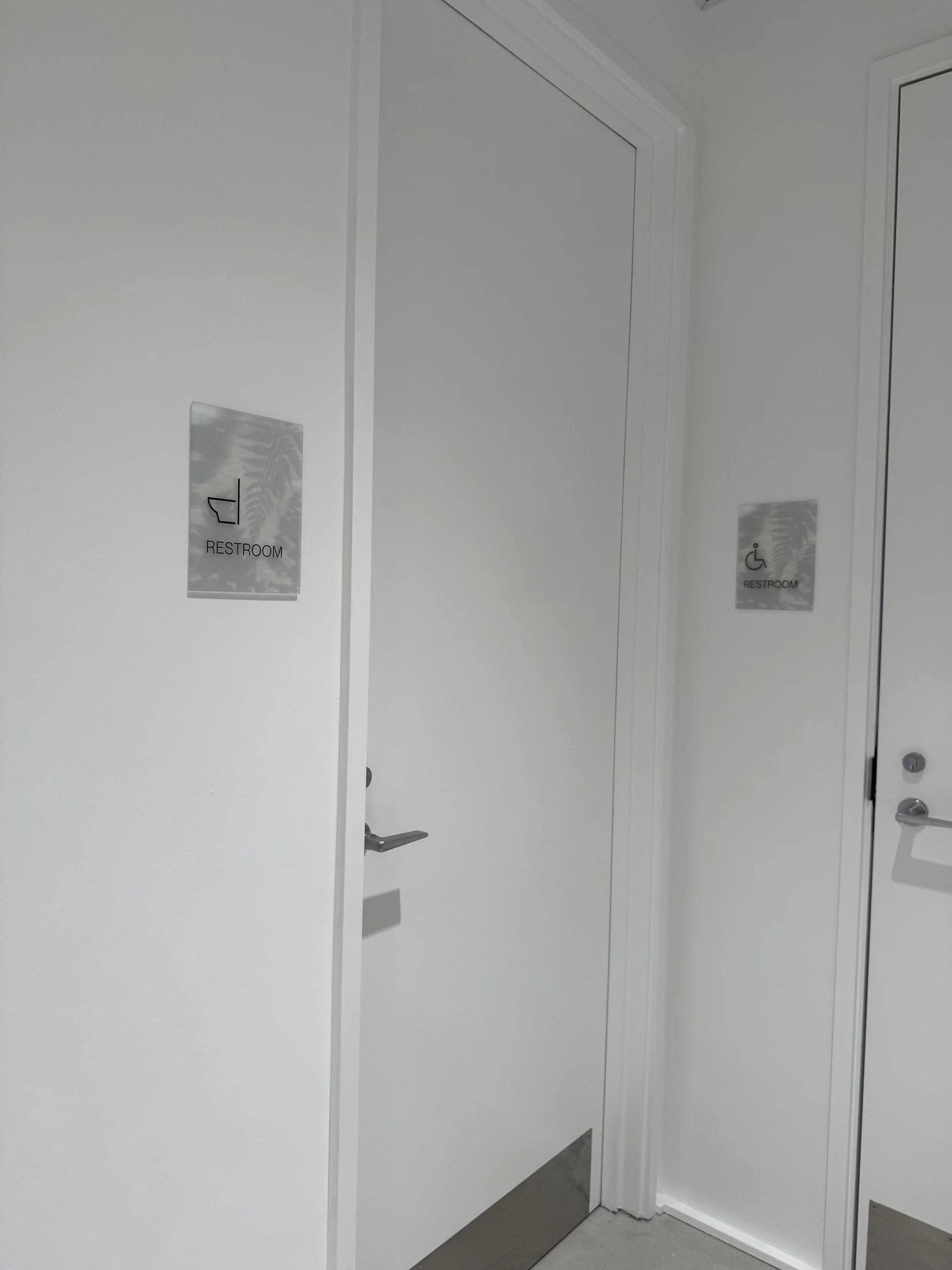 Restrooms with botanical glass identification