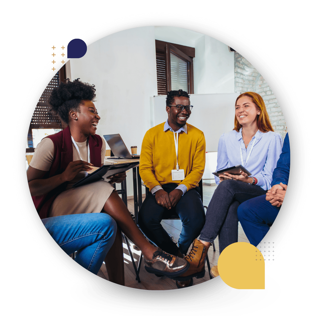 Four diverse people smiling and chatting in a CultureAlly in person workshop.