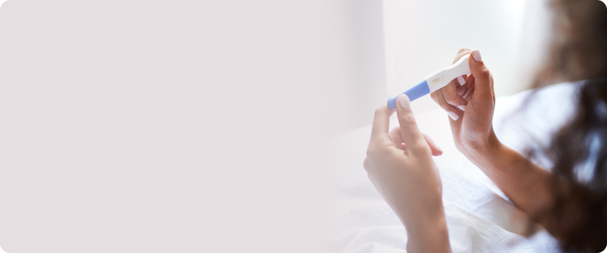 Hands holding a pregnancy test, representing Bay Area fertility and pregnancy therapy