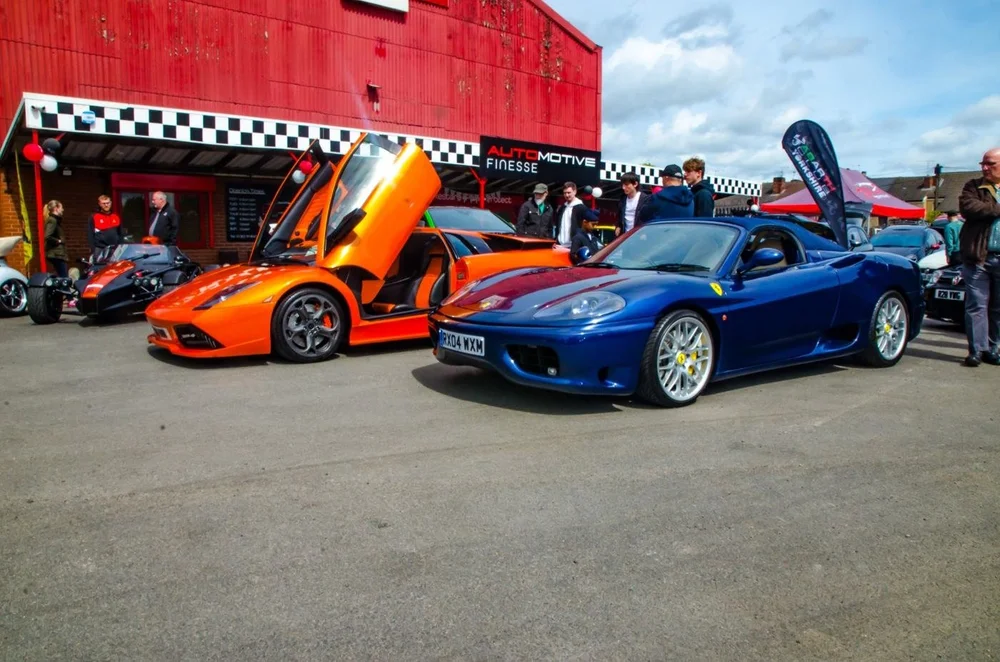 Supercars on the forecourt at the Open Day