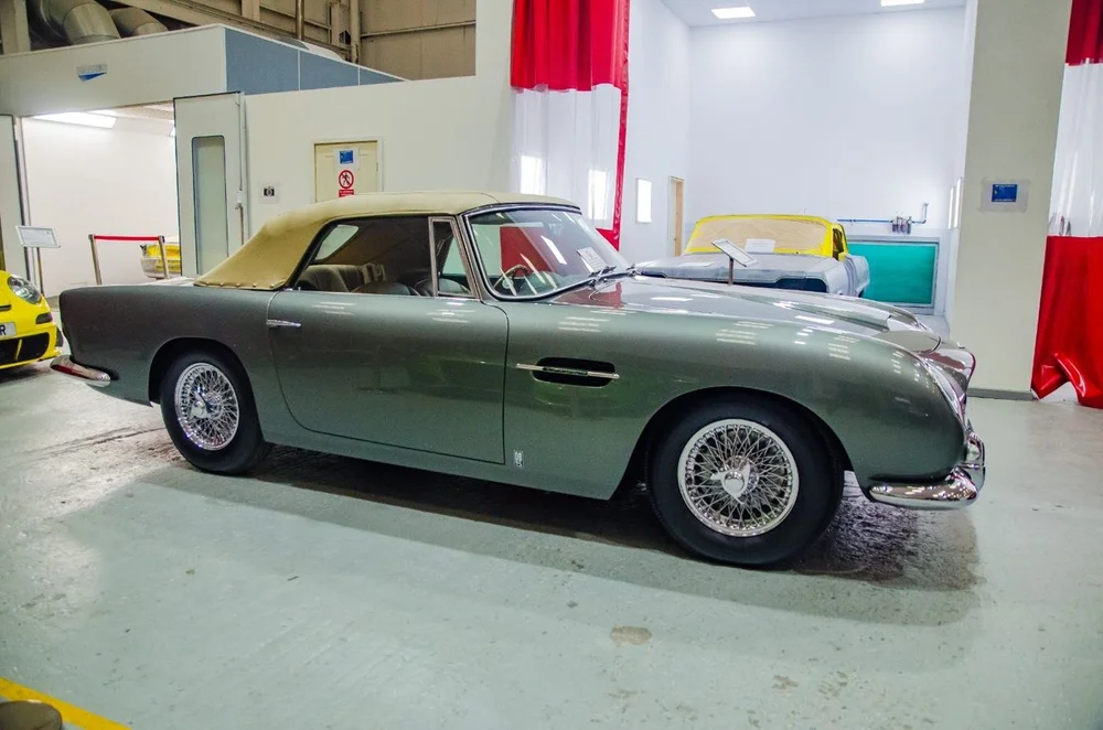 A classic Aston Martin on show in the workshop