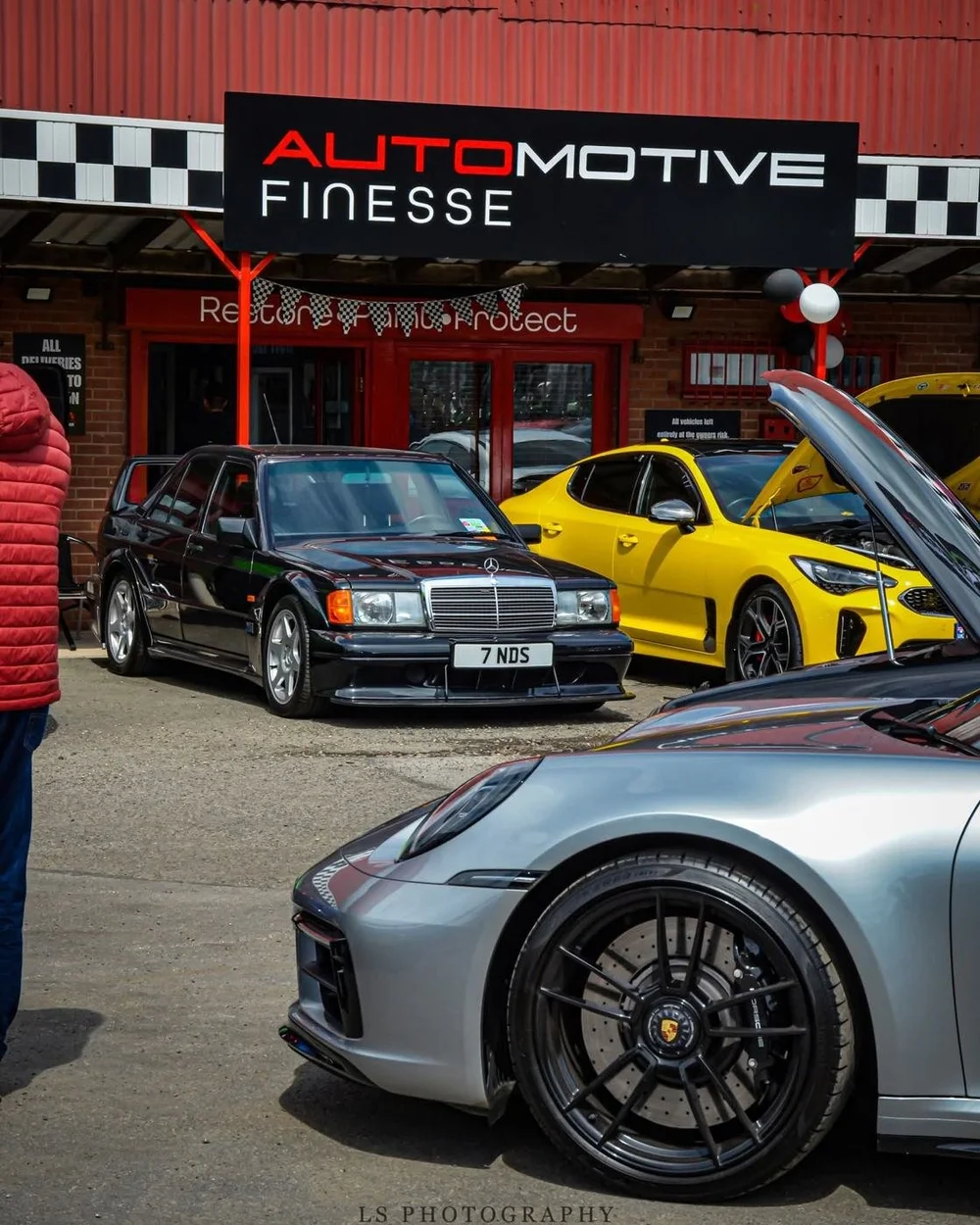 Cars lined up outside the Big Red Shed at the Automotive Finesse Open Day