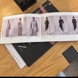 A lookbook open on a showroom table