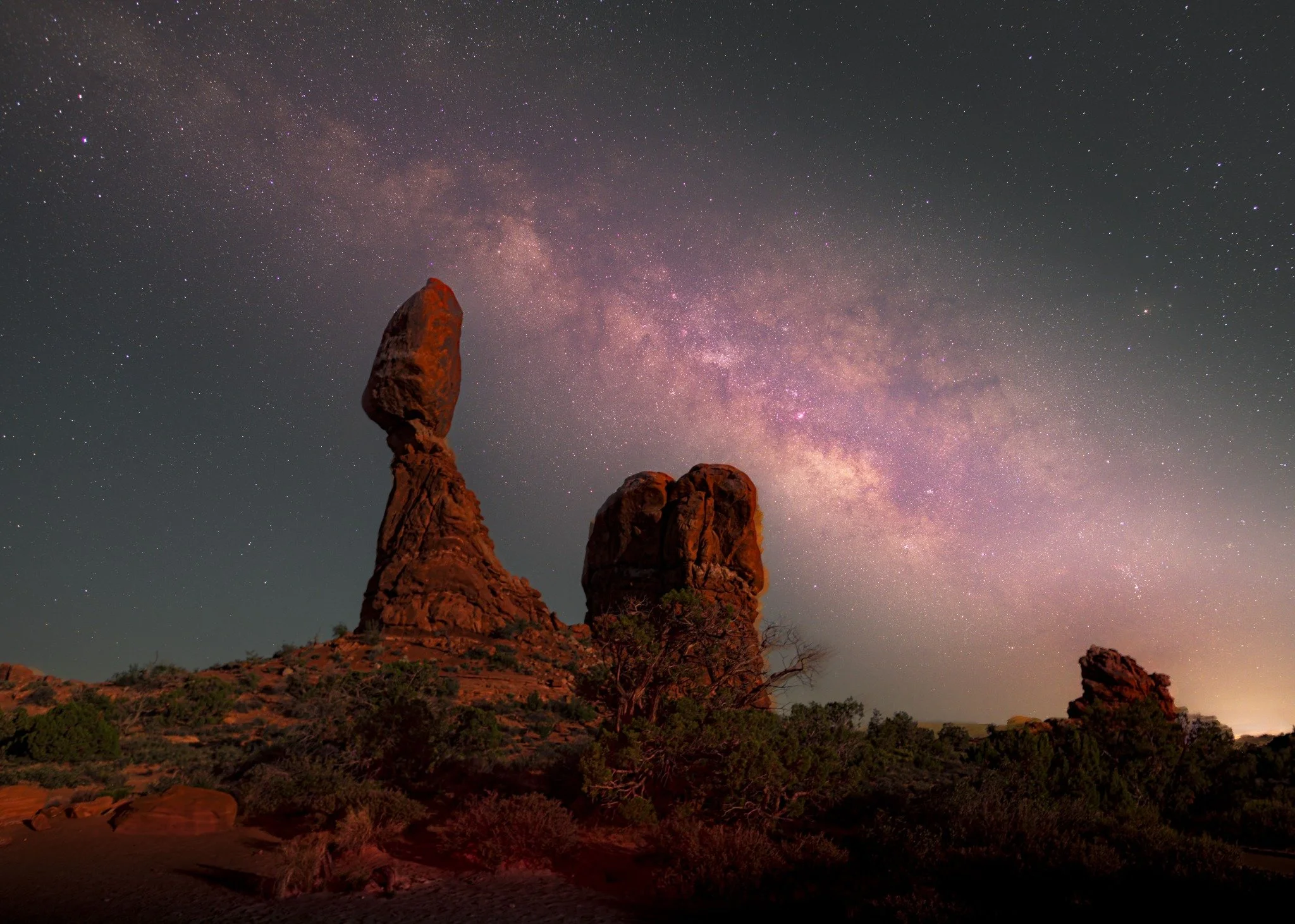 Milky Way above Balance Rock and desert rock formations