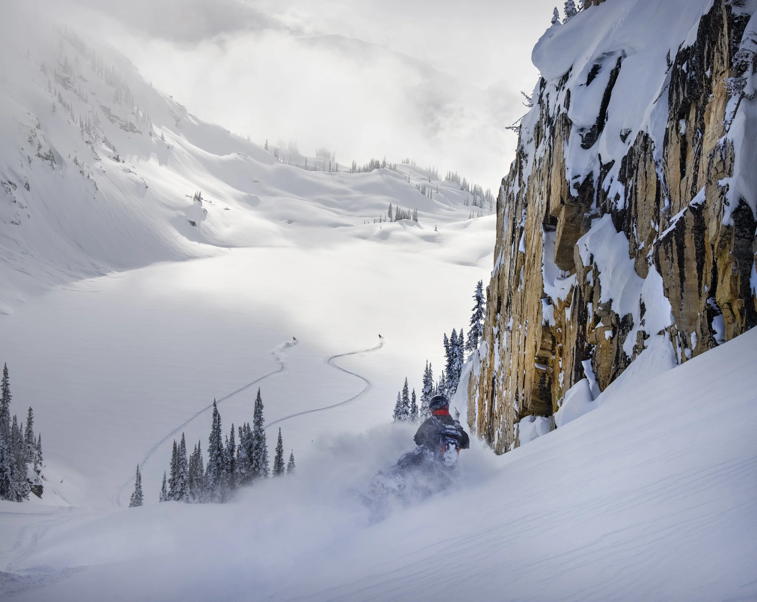 Deep snow mountain snowmobiling in Revelstoke, British Columbia