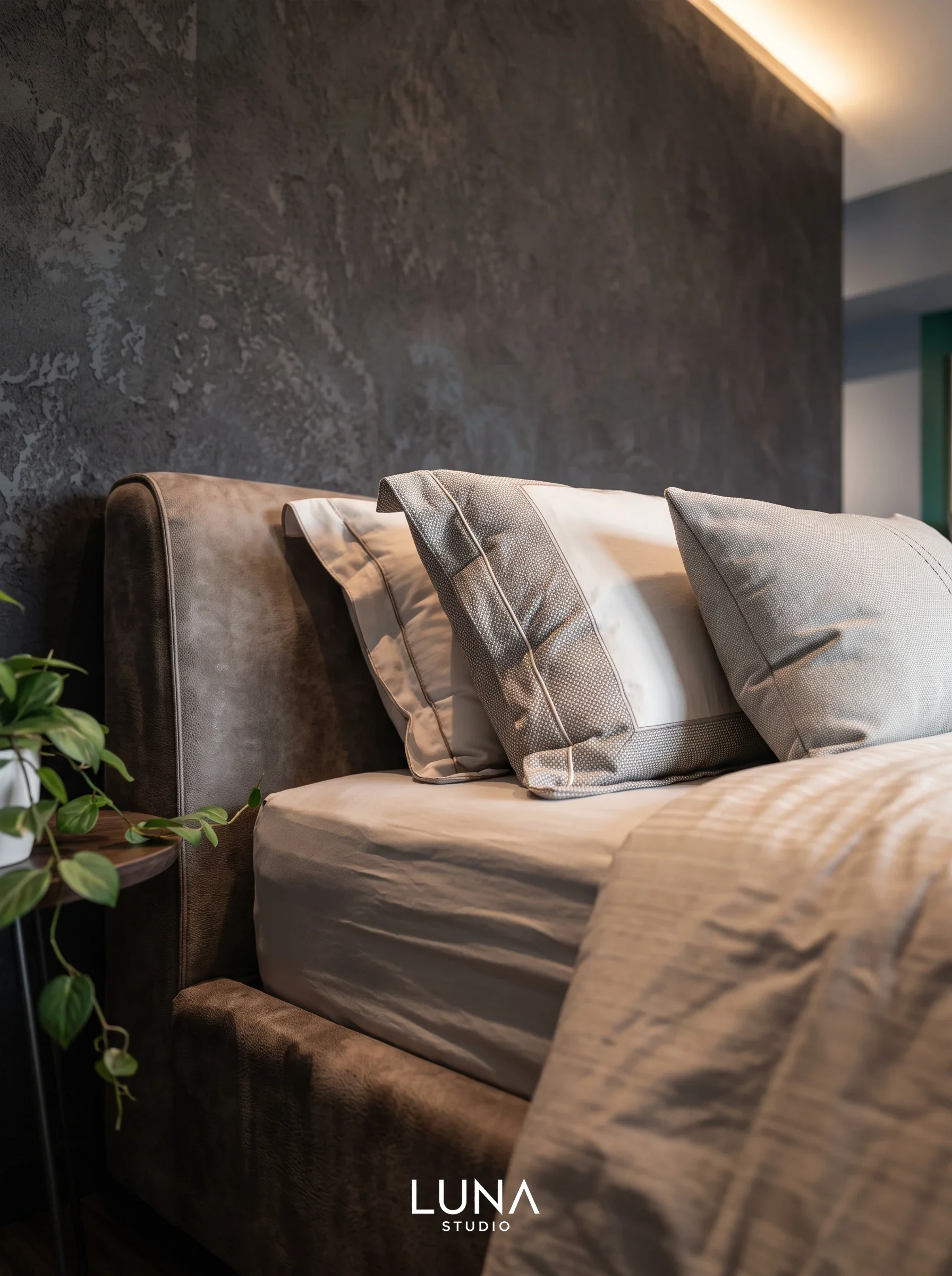 Bedroom decor with upholstered headboard.