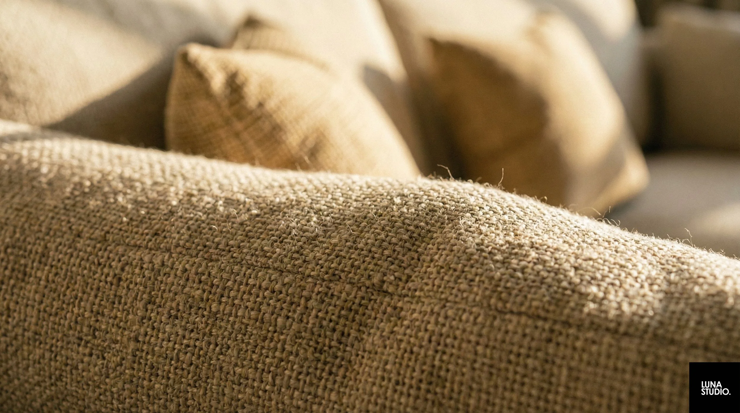 Soft fabric sofa textures complementing the warm wooden interior theme