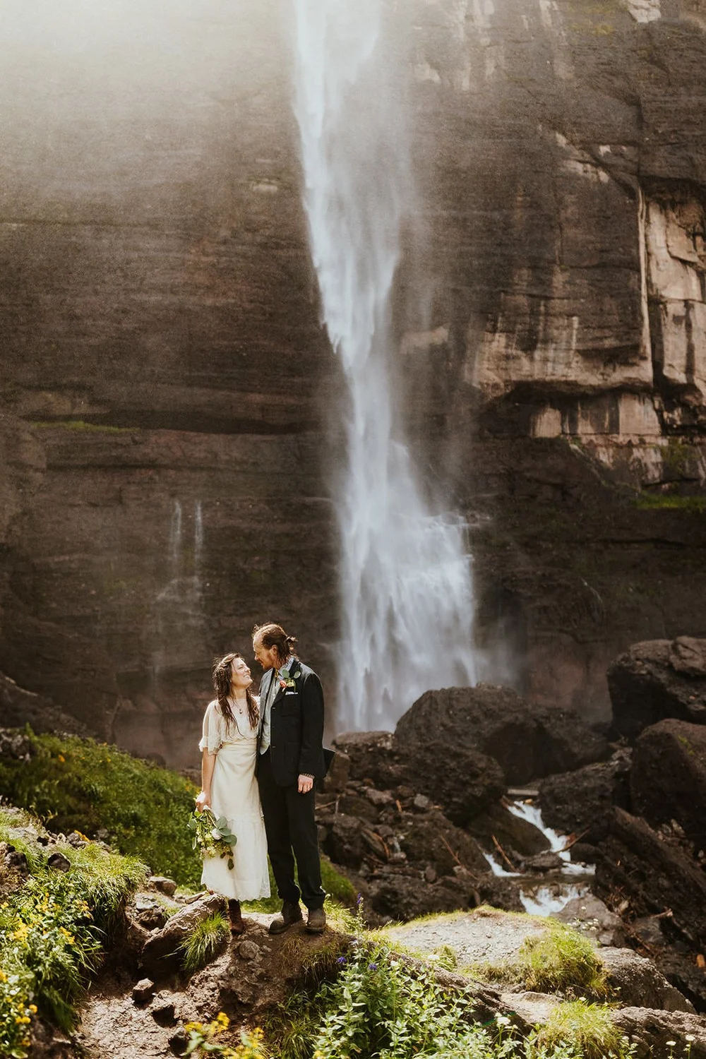 A couple elopes at Bridal Veil Falls outside of Telluride, Colorado