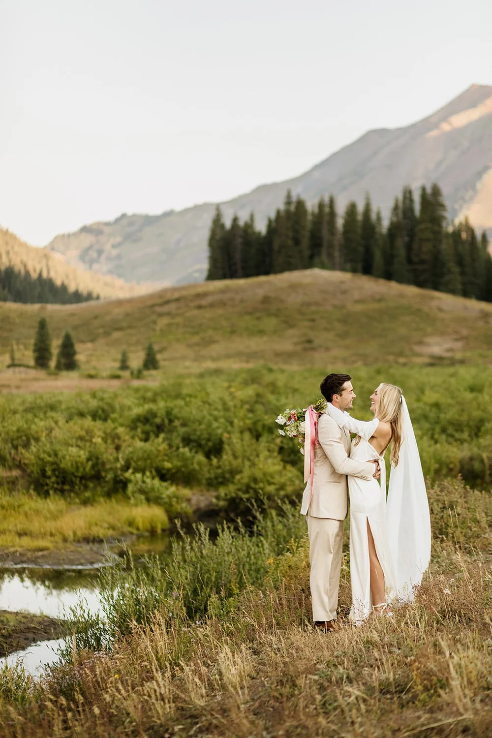 Colorado elopement photography near Crested Butte, a couple embraces outside of Gothic Valley