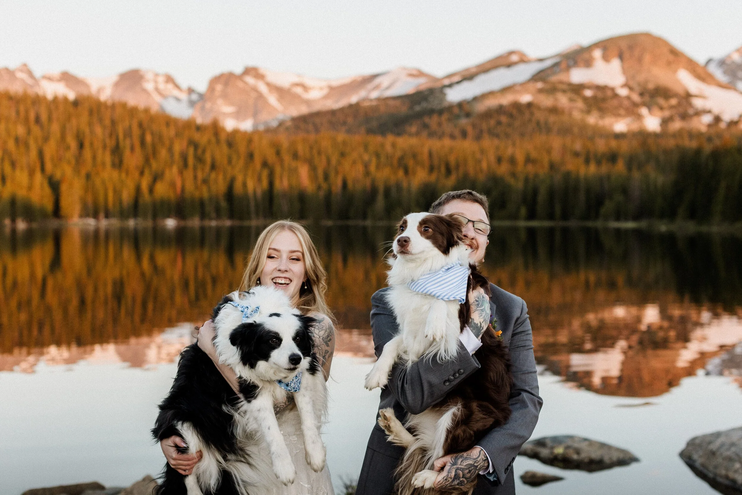 Couple exchanging vows beside Long Lake in the Brainard Lake Recreation Area during their spring solstice elopement in Colorado
